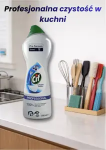 Mleczko czyszczące Cif Cream Professional obok organizerem z akcesoriami kuchennymi na blacie.
